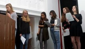 Photo taken by Steve Neiman of the body shaming portion of LREI's International Day of the Girl Assembly (from left to right: Stelle Rose Gahan, Alexa Code, Avery Kutis, Nathalie Friedman, E Jerimijenjo-Conley, Caroline Lobe)